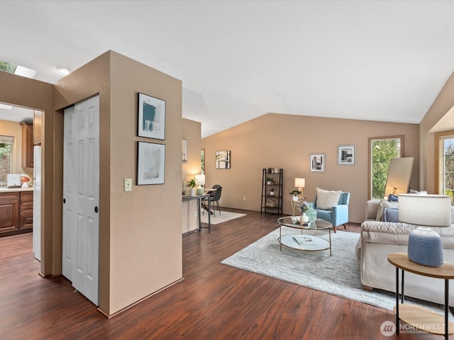 living room with lofted ceiling and dark wood-style floors