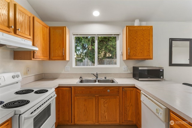 kitchen with sink and white appliances