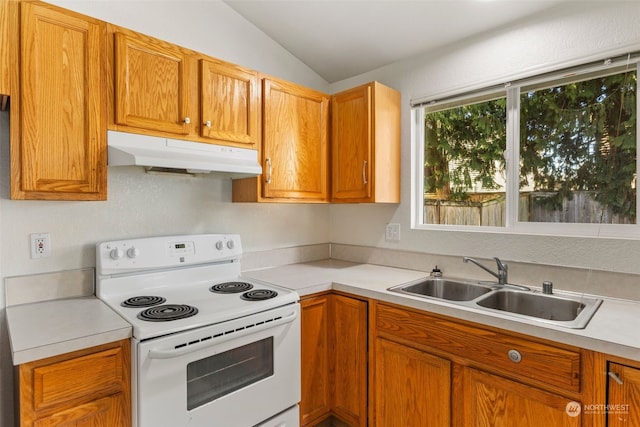 kitchen with lofted ceiling, sink, and white range with electric stovetop