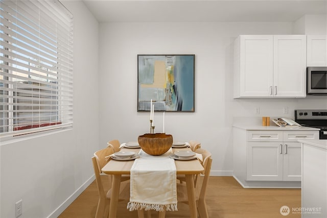 1510E Hollow Dale Pl, Everett, WA 98204 - dining room with light wood-style floors and baseboards