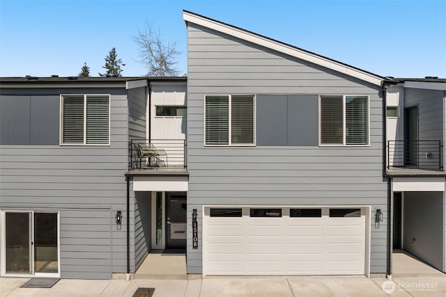 1510E Hollow Dale Pl, Everett, WA 98204 - view of front of property featuring a balcony, an attached garage, and driveway