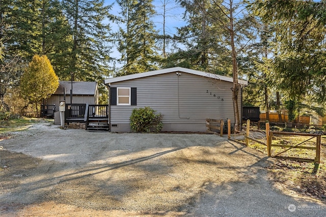 view of home's exterior featuring a deck