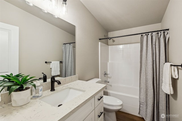 full bathroom with vanity, shower / bathtub combination with curtain, and toilet