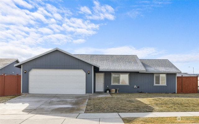 ranch-style house featuring a garage