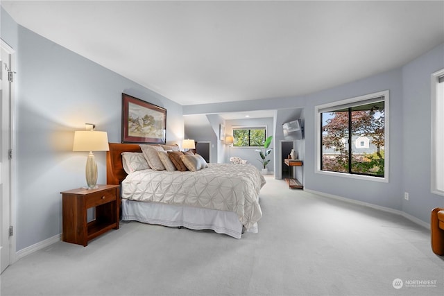 bedroom featuring light colored carpet