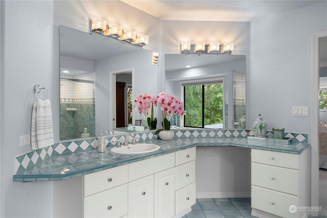 bathroom with vanity and tile patterned flooring