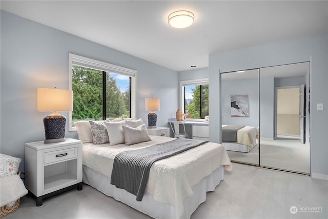 carpeted bedroom featuring a closet