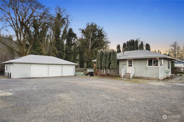 view of front of house with an outbuilding and a garage