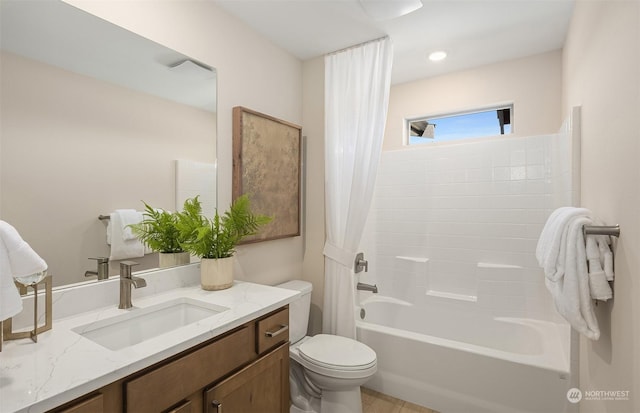 full bathroom with vanity, toilet, and shower / bath combo with shower curtain