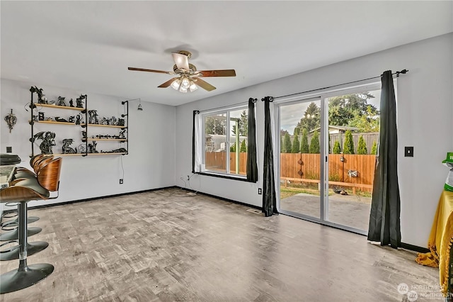 interior space with light hardwood / wood-style floors and ceiling fan