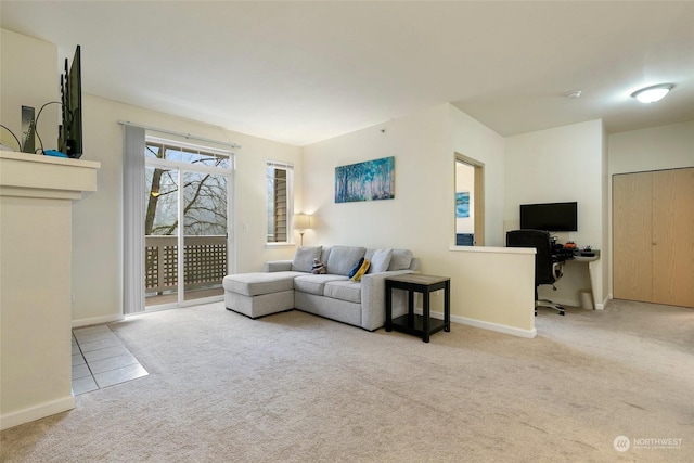 living room featuring light carpet