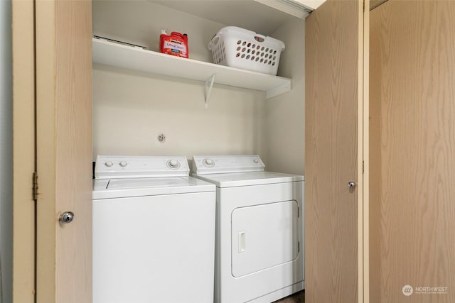 laundry area with washing machine and clothes dryer