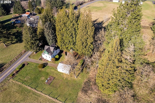 birds eye view of property with a rural view