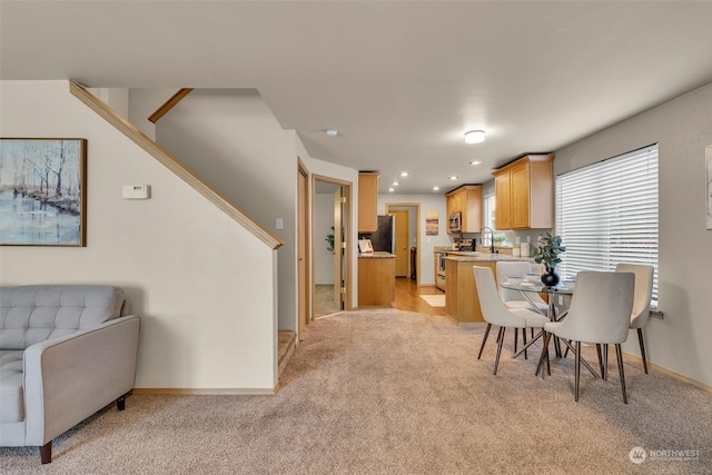 view of carpeted dining space