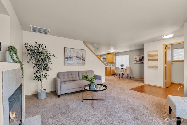 carpeted living room with a healthy amount of sunlight