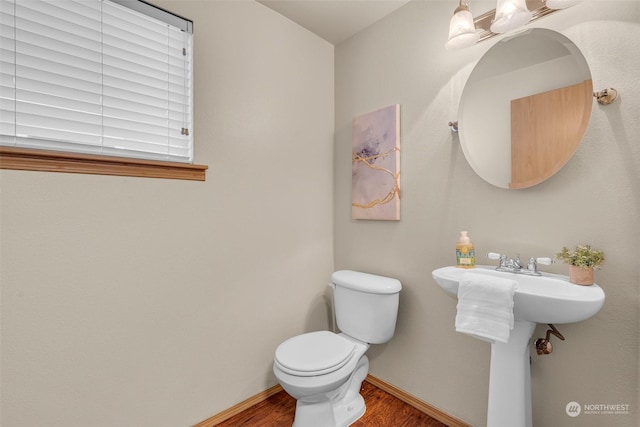 bathroom featuring toilet and hardwood / wood-style floors