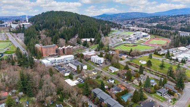 birds eye view of property with a mountain view