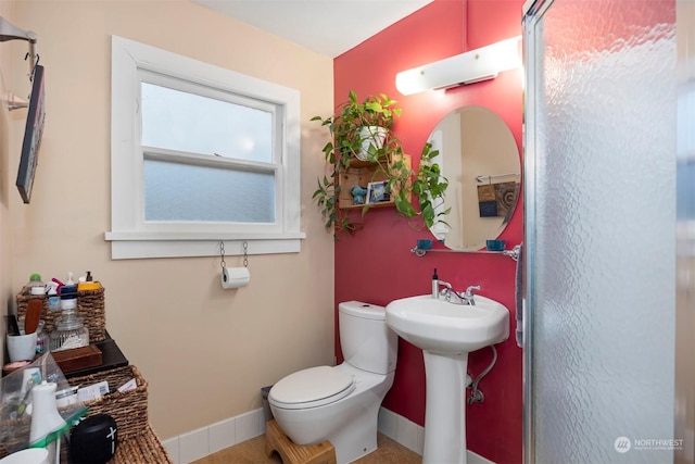 bathroom featuring sink and toilet