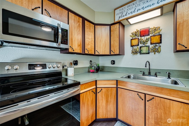 kitchen with sink and appliances with stainless steel finishes