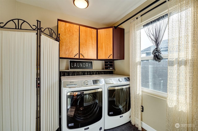 washroom with cabinets and independent washer and dryer