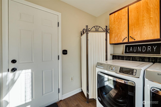 clothes washing area with independent washer and dryer, cabinets, and dark wood-type flooring