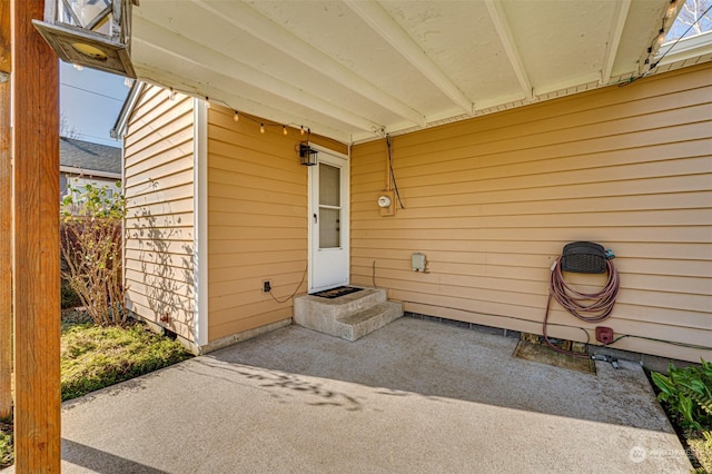 entrance to property with a patio