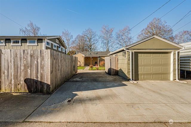 view of property exterior featuring a garage and an outdoor structure