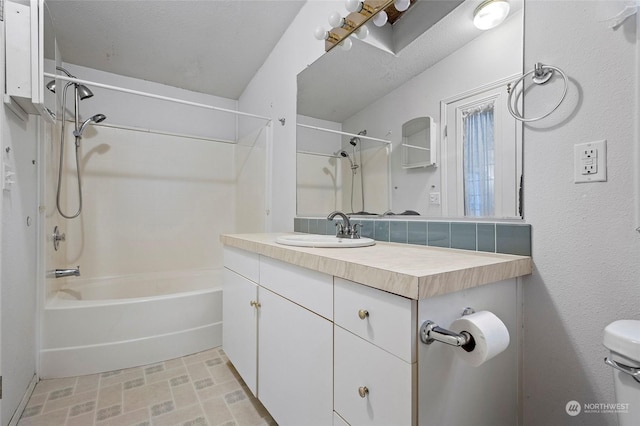 full bathroom featuring shower / washtub combination, toilet, vanity, and backsplash