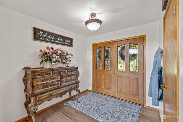 entrance foyer with light hardwood / wood-style flooring