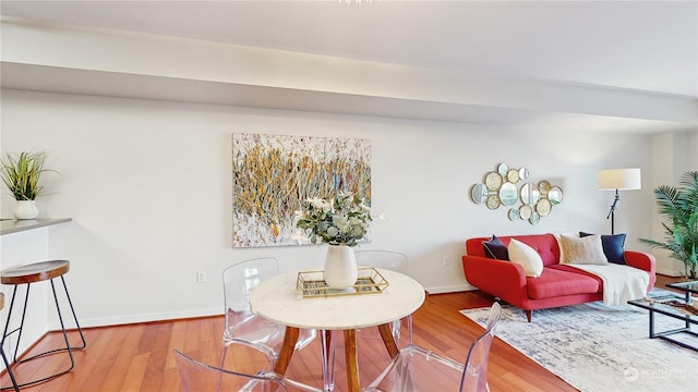 dining space with hardwood / wood-style floors