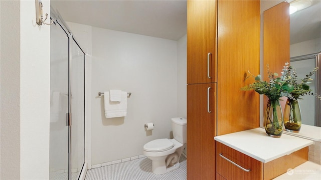 bathroom with toilet, a shower with shower door, and tile patterned flooring