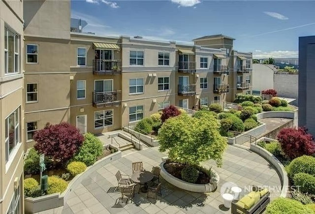 view of property's community with a patio