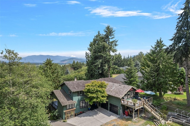 birds eye view of property featuring a mountain view