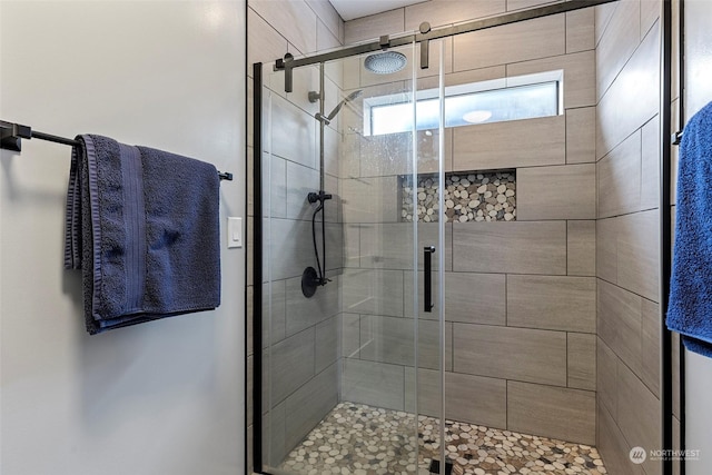 bathroom featuring an enclosed shower