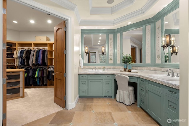 bathroom with ornamental molding, vanity, and a tray ceiling