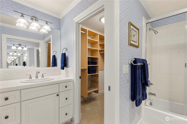 bathroom featuring vanity, crown molding, and tiled shower / bath