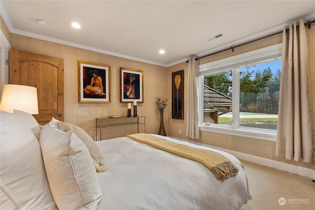 bedroom with ornamental molding and carpet