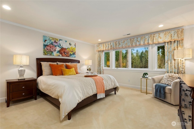 bedroom with crown molding and light colored carpet