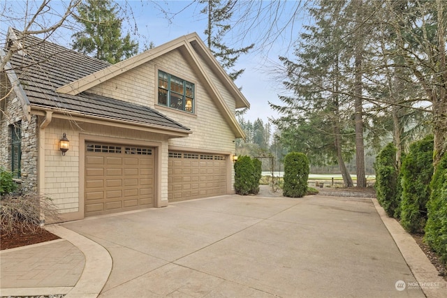 view of property exterior featuring a garage