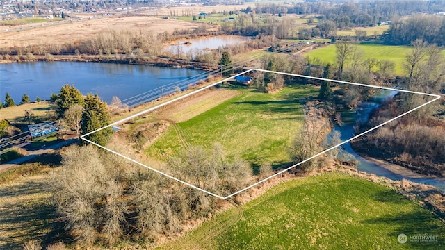 aerial view featuring a rural view and a water view