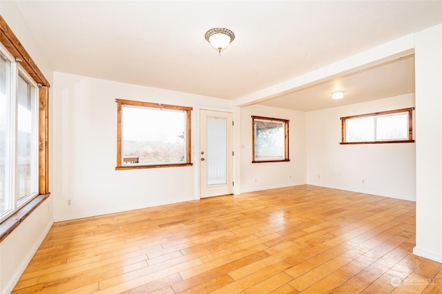 unfurnished room featuring light hardwood / wood-style floors