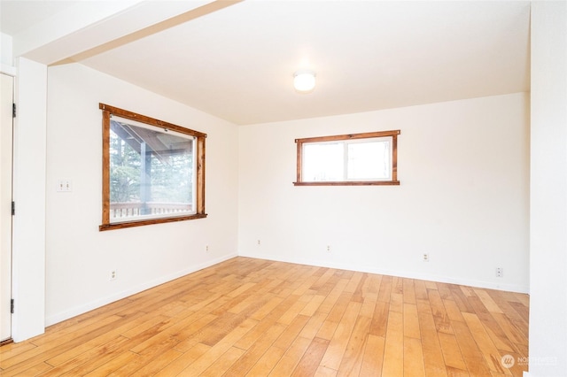 spare room featuring light hardwood / wood-style floors