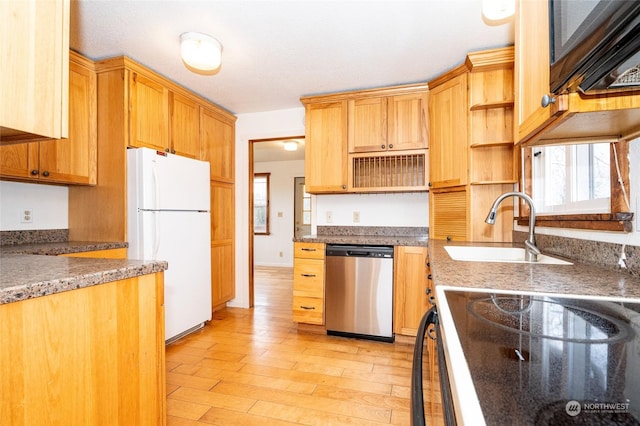 kitchen with sink, light wood-type flooring, dishwasher, white fridge, and range with electric cooktop