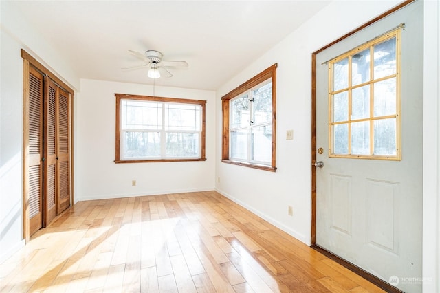 interior space with light hardwood / wood-style floors and ceiling fan