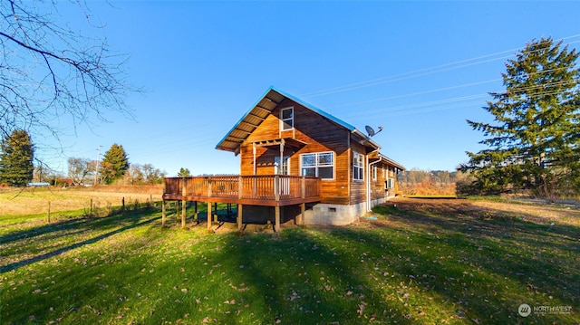 back of house with a yard and a deck