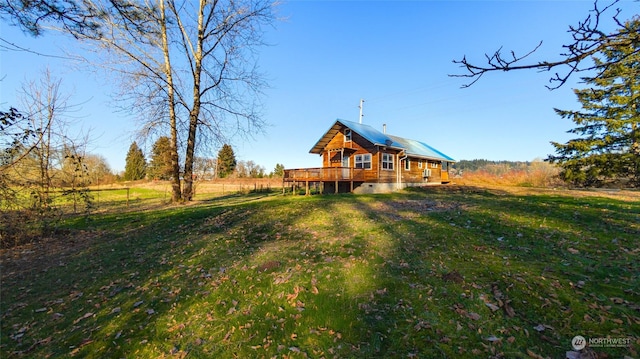 view of yard featuring a wooden deck