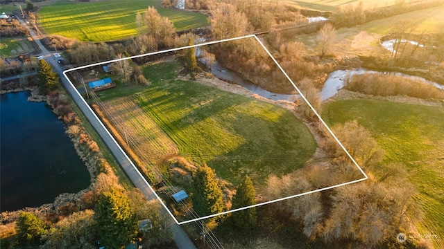 aerial view featuring a water view and a rural view