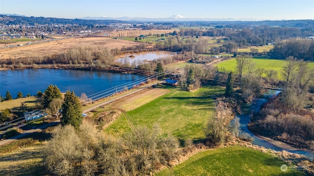 aerial view with a rural view and a water and mountain view