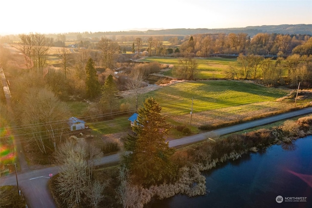 drone / aerial view featuring a rural view and a water view