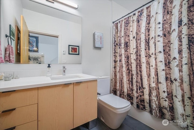 bathroom with vanity and toilet